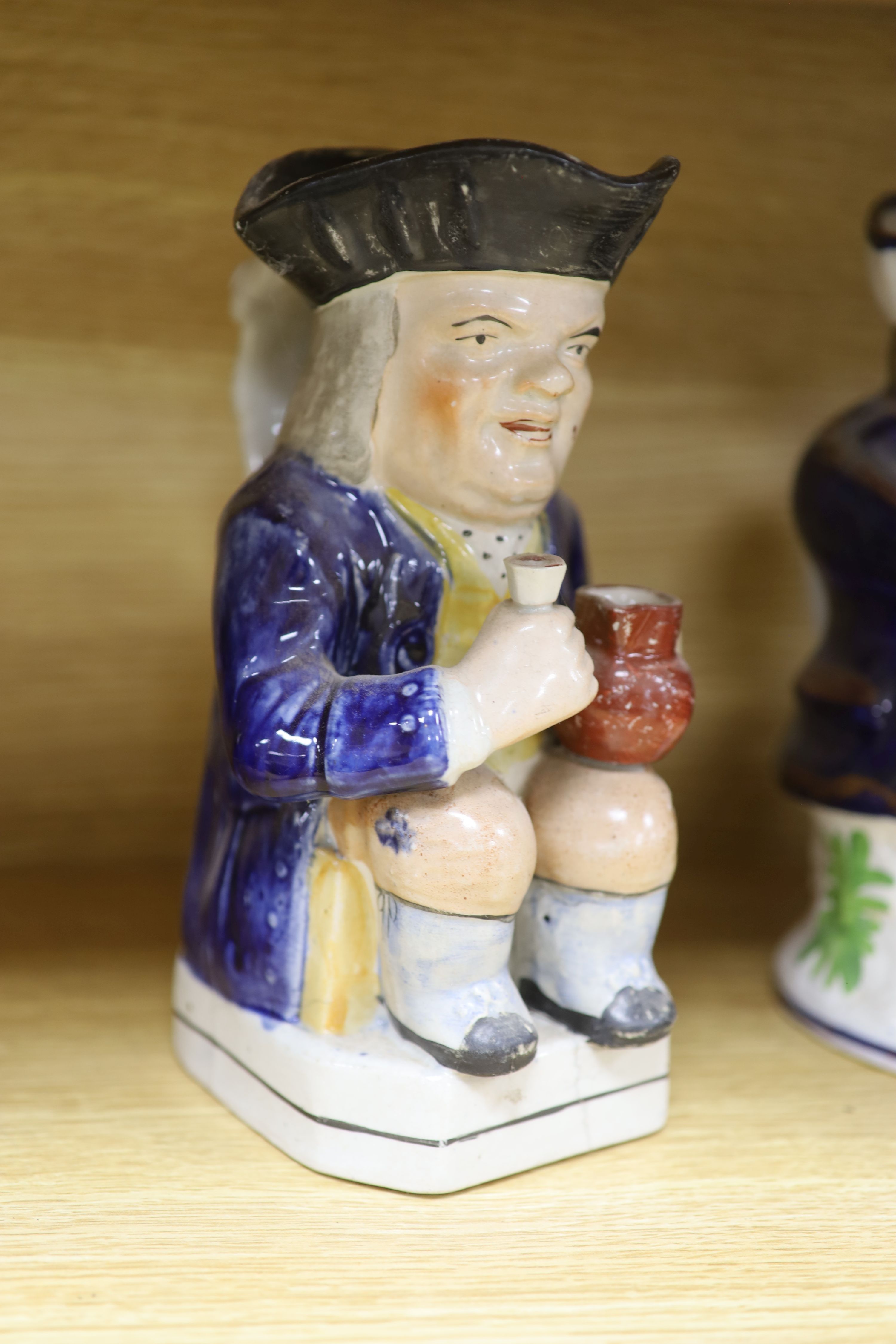 A quantity of Staffordshire pottery, including four Toby jugs, four figures, a copper lustre jug and a silver resist jug (10)